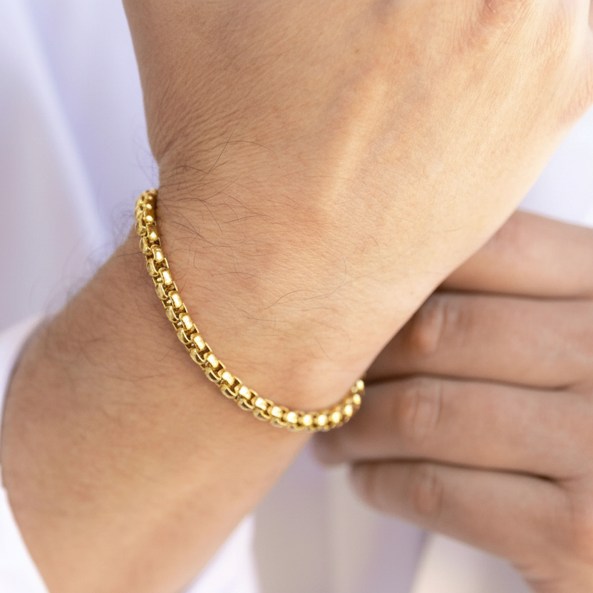 Man wearing gold essential chain bracelet