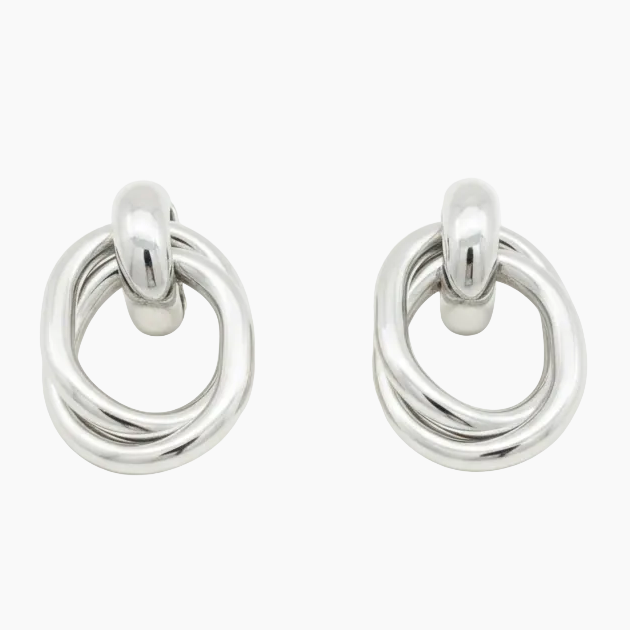 Silver earrings laid down flat